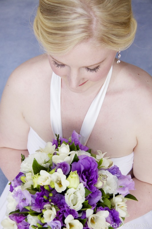 Bride looking down at her flowers - wedding photography sydney